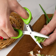 Stainless steel kitchen scissors for cutting, shredding, and chopping ingredients.