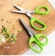 Stainless steel kitchen scissors for cutting, shredding, and chopping ingredients.