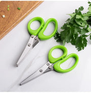 Stainless steel kitchen scissors for cutting, shredding, and chopping ingredients.